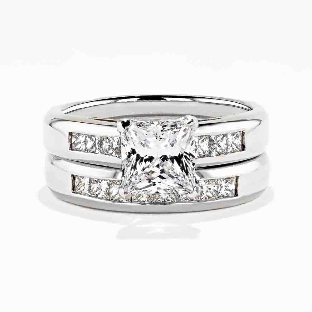 Melanie Wedding Set featuring a princess cut 1.50ct Diamond Hybrid® engagement ring in recycled 14K white gold with .30ctw side stones and a matching wedding band with .40ctw channel set stones | Melanie Wedding Set 1.50ct Diamond Hybrid engagement ring wedding band