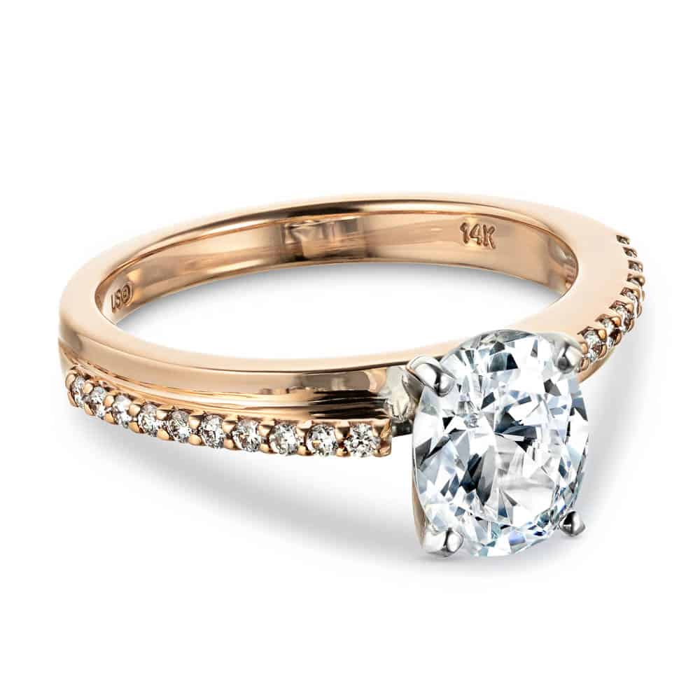 Shown with a 1.0ct Oval cut Lab-Grown Diamond with accenting diamonds on the band in recycled 14K rose gold 
