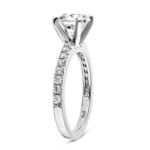 Diamond accented engagement ring with 1ct round cut lab grown diamond in platinum setting shown from side