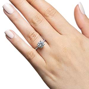 Diamond accented engagement ring with 1ct round cut lab grown diamond in 14k white gold band worn on hand
