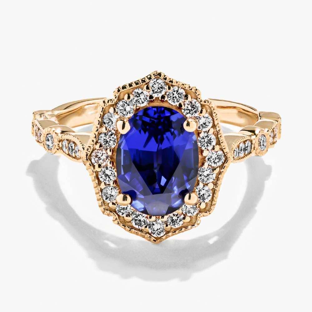 Shown in 14K Yellow Gold with an Oval Cut Lab Created Blue Sapphire Gemstone