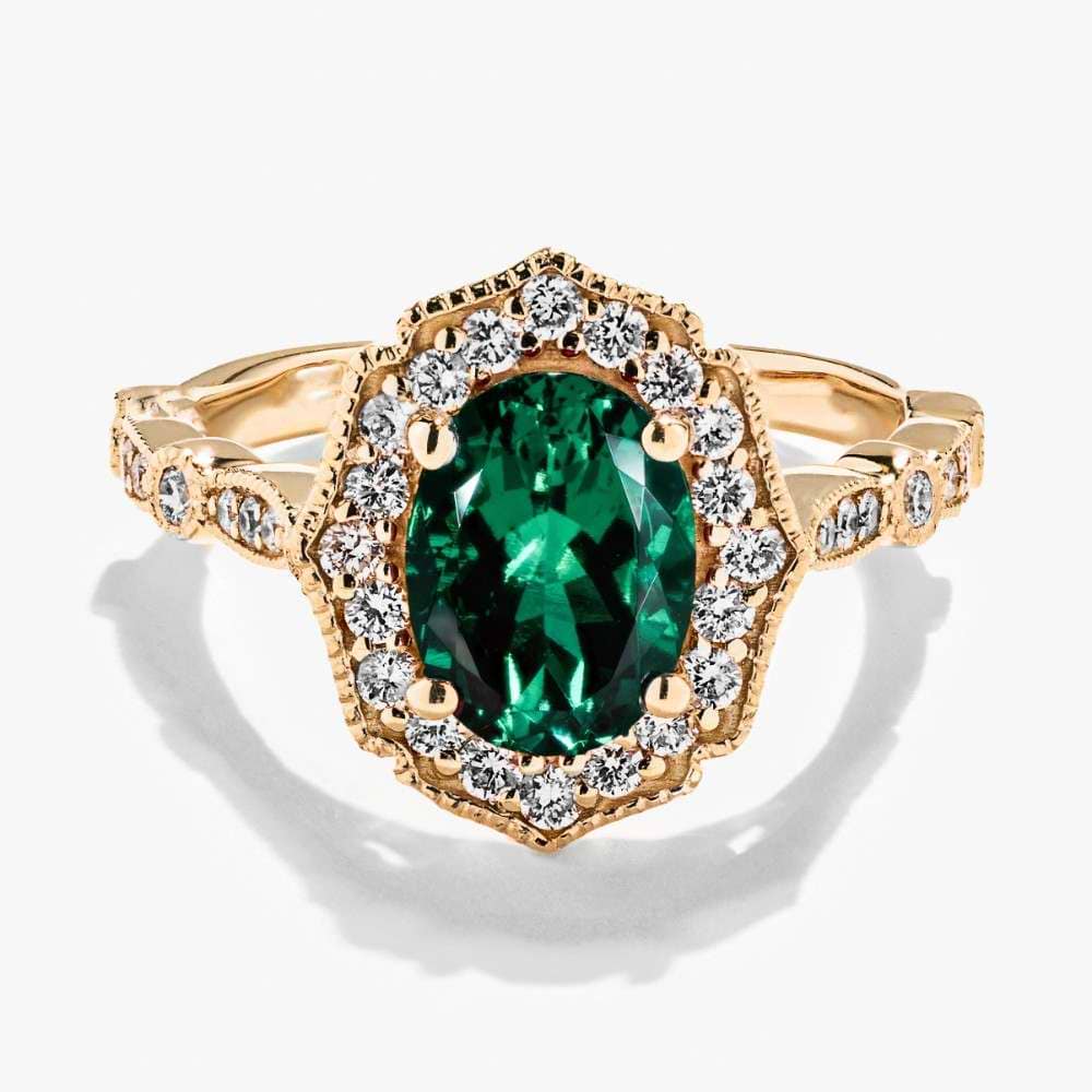 Shown in 14K Yellow Gold with an Oval Cut Lab Created Emerald Gemstone