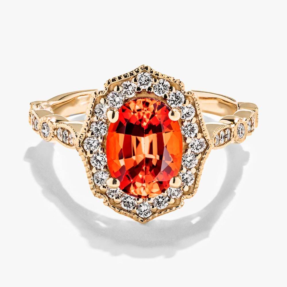 Shown in 14K Yellow Gold with an Oval Cut Lab Created Padparadscha Gemstone