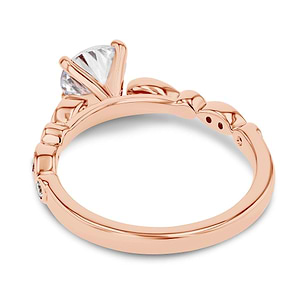 diamond accented engagement ring with round cut lab grown diamond center stone set in 14k rose gold recycled metal