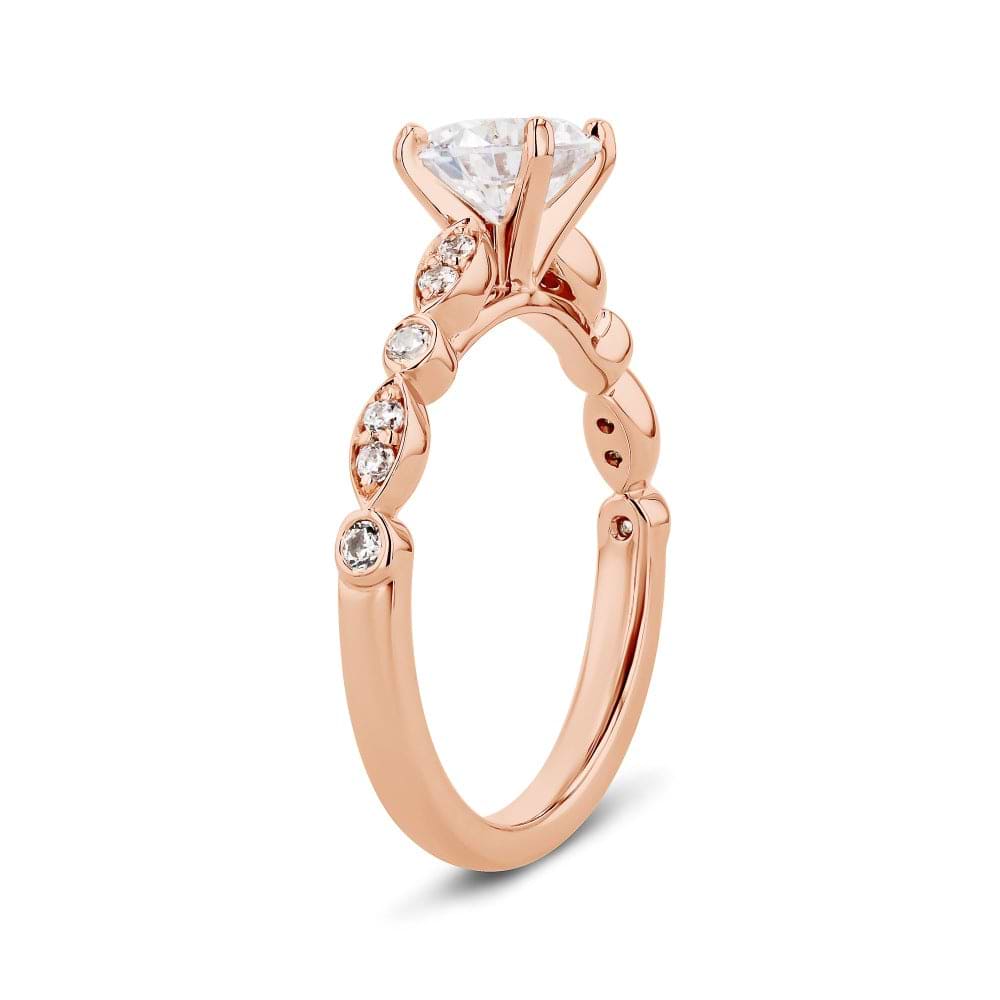 Shown here with a 1.0ct Round Cut Lab Grown Diamond center stone in 14K Rose Gold|diamond accented engagement ring with round cut lab grown diamond center stone set in 14k rose gold recycled metal