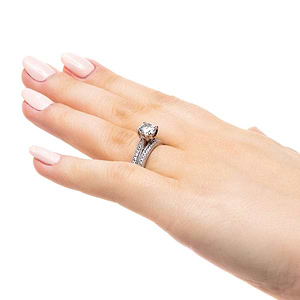  wedding set two tone Shown with a 1.0ct Round cut Lab-Grown Diamond with diamonds accenting the band and filigree details in recycled 14K white gold with matching wedding band