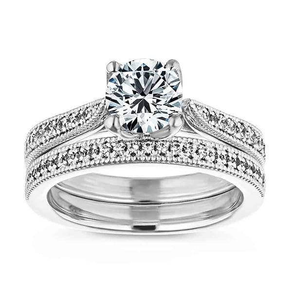 Shown with a 1.0ct Round cut Lab-Grown Diamond with diamonds accenting the band and filigree details in recycled 14K white gold with matching wedding band, can be purchased together for a discounted price| wedding set two tone Shown with a 1.0ct Round cut Lab-Grown Diamond with diamonds accenting the band and filigree details in recycled 14K white gold with matching wedding band