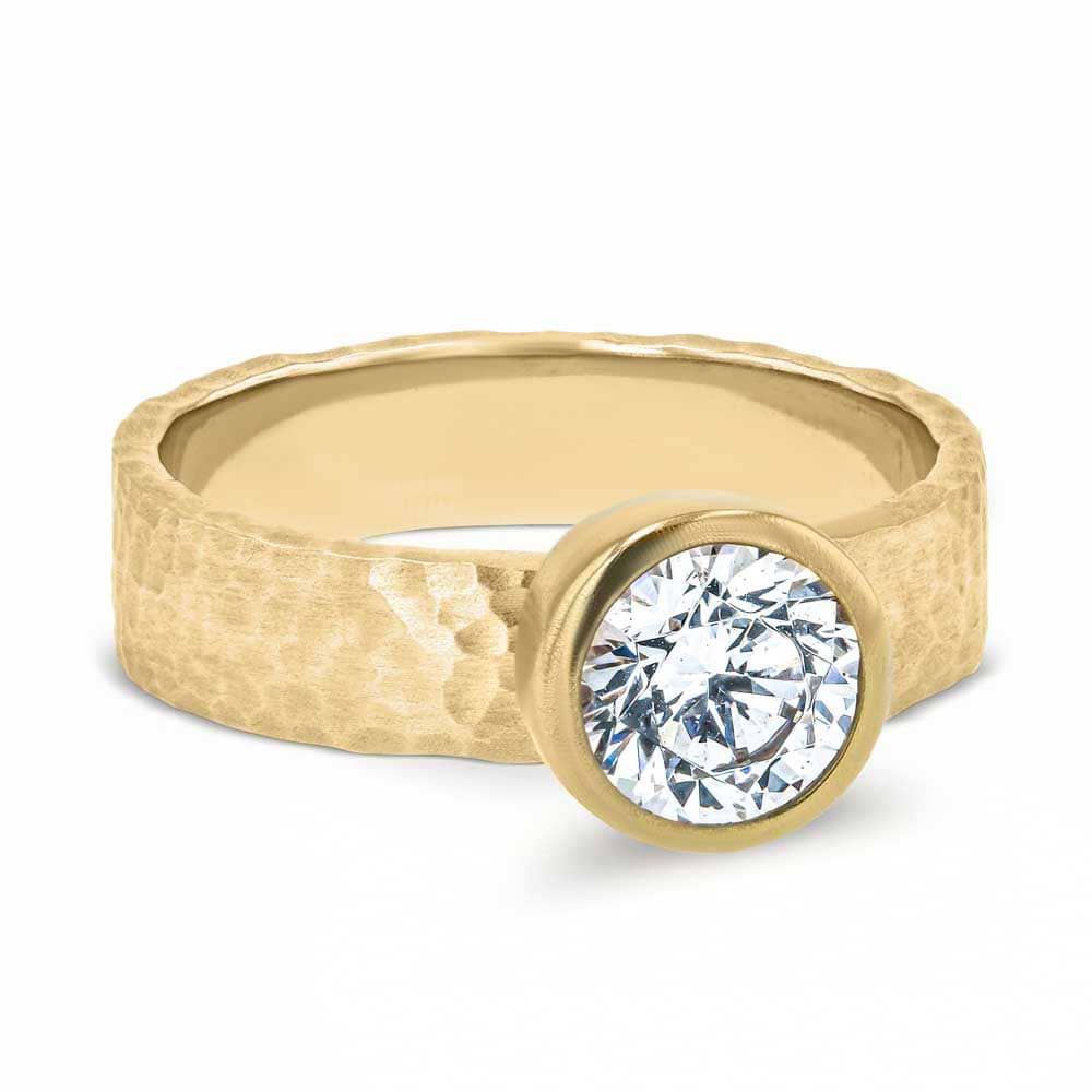 Shown in 14K Yellow Gold with a Satin Hammer Finish|bezel set solitaire engagement ring with round cut lab grown diamond in 14k yellow gold satin hammer finish band