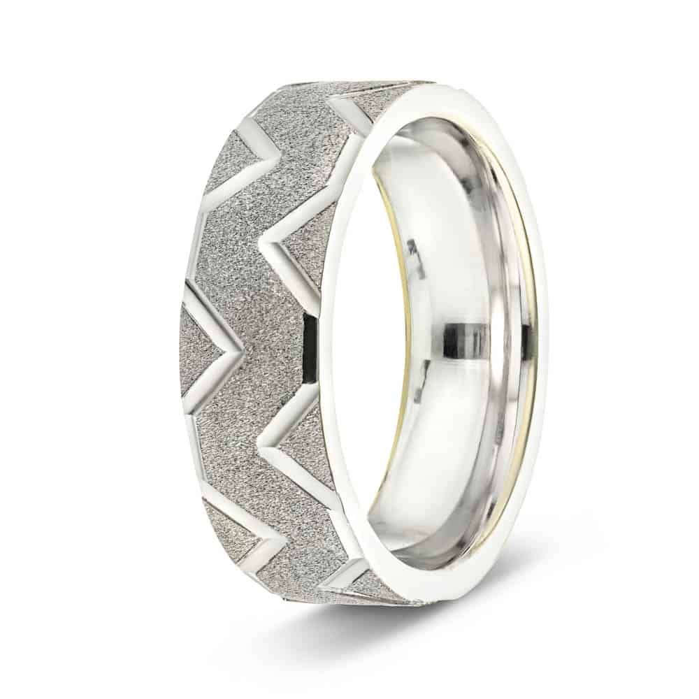 Men&#39;s Wedding Band with intricate groove design in satin finish in recycled 14K white gold 