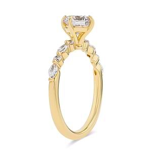 summer engagement ring with diamond accenting stones and a round cut center stone set in 14k yellow gold metal