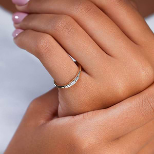 Three Stone Baguette Band in 14 Carat Gold with Lab Grown Diamond by MiaDonna worn on woman’s pinky finger