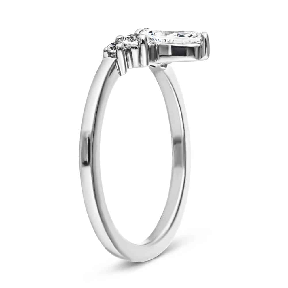 Shown here with a center 0.33ct marquis lab-grown diamond in recycled 14K white gold, with recycled earth-mined diamonds on either side.  | Lab-grown diamond and recycled diamond white gold traditional engagement ring.