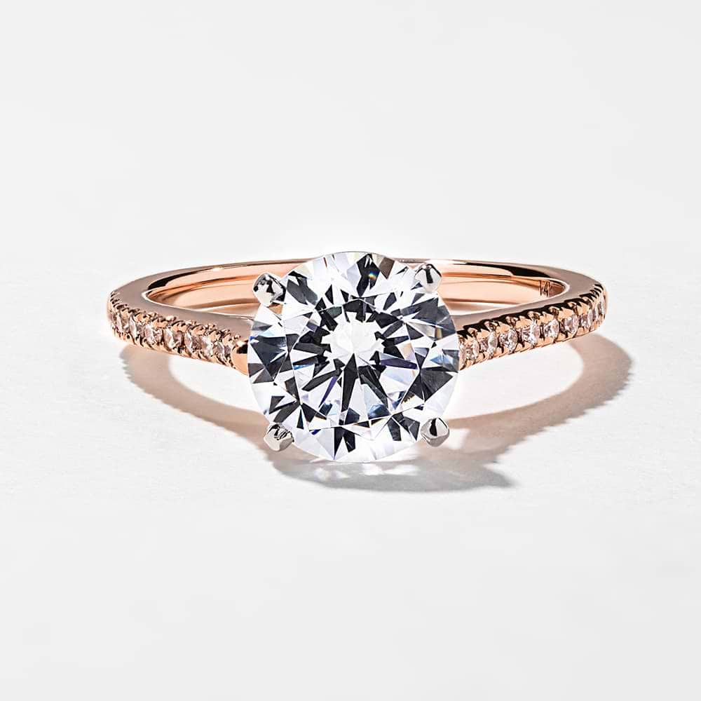 Shown with 1.5ct Round Cut Lab-Grown Diamond in 14k Rose Gold with a White Gold Prong Head