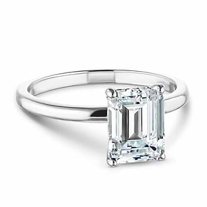 Classic traditional solitaire engagement ring with 2ct emerald cut lab grown diamond in platinum setting
