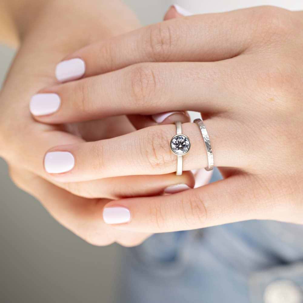 Shown in 14K White Gold with a Satin Hammer Finish Paired With The Rustic Engagement Ring in 14K White Gold with a Satin Finish