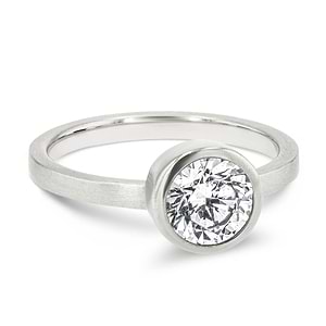 bezel set solitaire engagement ring with round cut lab grown diamond in satin finish 14k white gold metal
