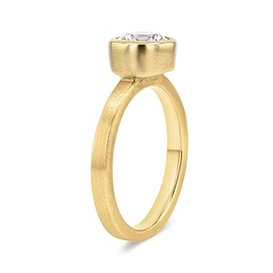 bezel set solitaire engagement ring with round cut lab grown diamond in satin finish 14k yellow gold metal