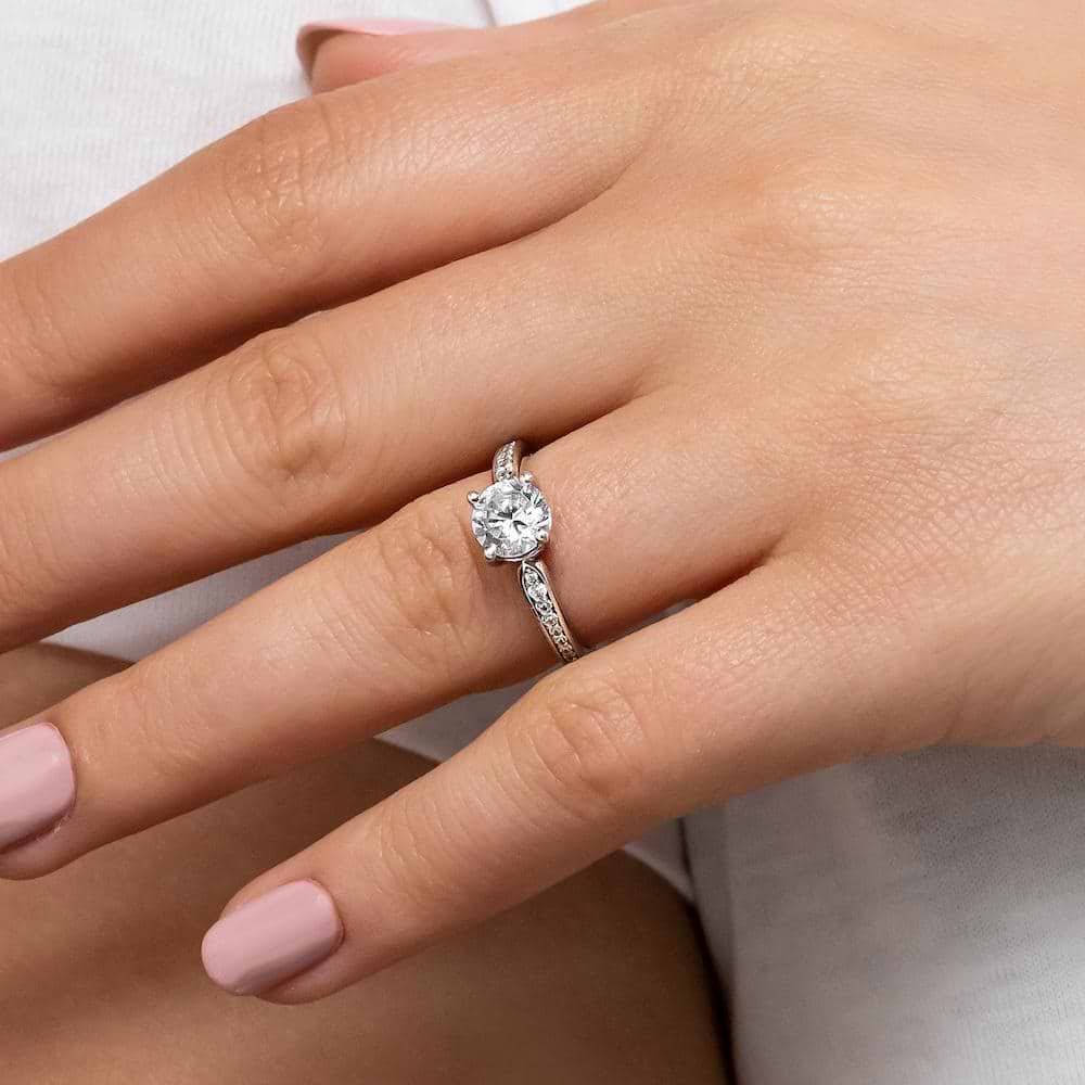 Shown with a 1.0ct Round cut Lab-Grown Diamond with accenting diamonds on the band in recycled 14K white gold | engagement ring Shown with a 1.0ct Round cut Lab-Grown Diamond with accenting diamonds on the band in recycled 14K white gold