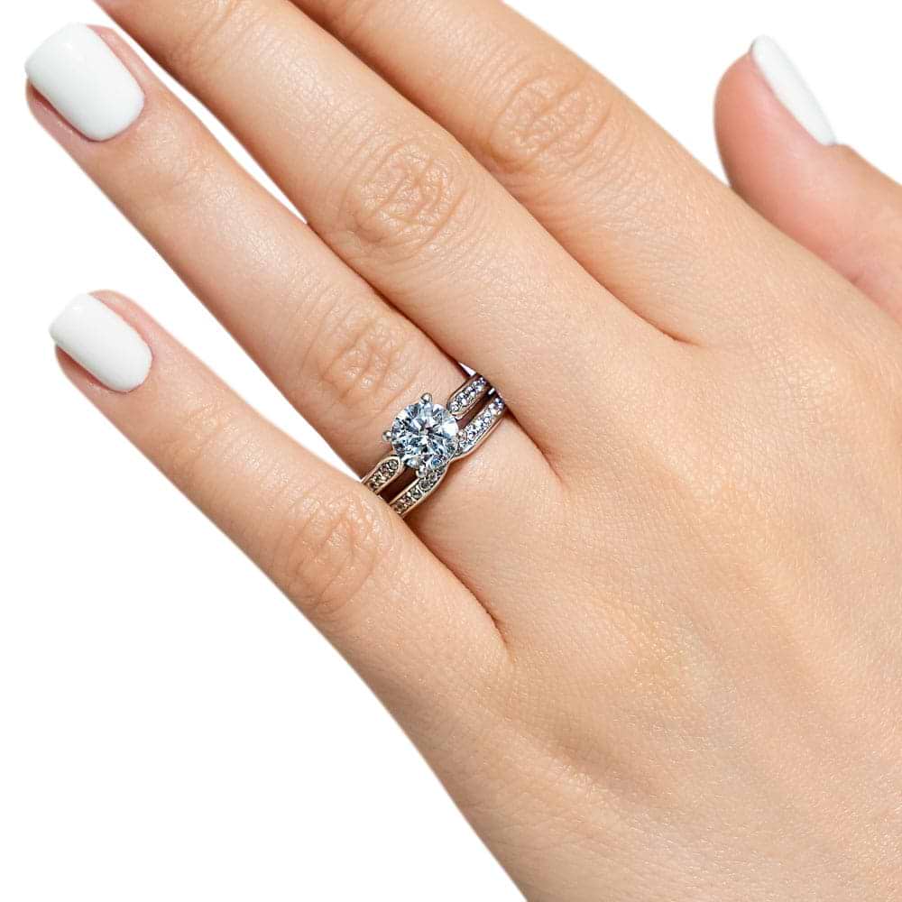 Unity Wedding Ring Set comes with your choice of round cut center stone accented with recycled diamonds channel set on engagement ring and wedding band&#39;s tapered shanks 