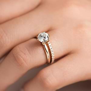  Diamond accented wedding band paired with a Traditional Solitaire Engagement ring in 14K rose gold
