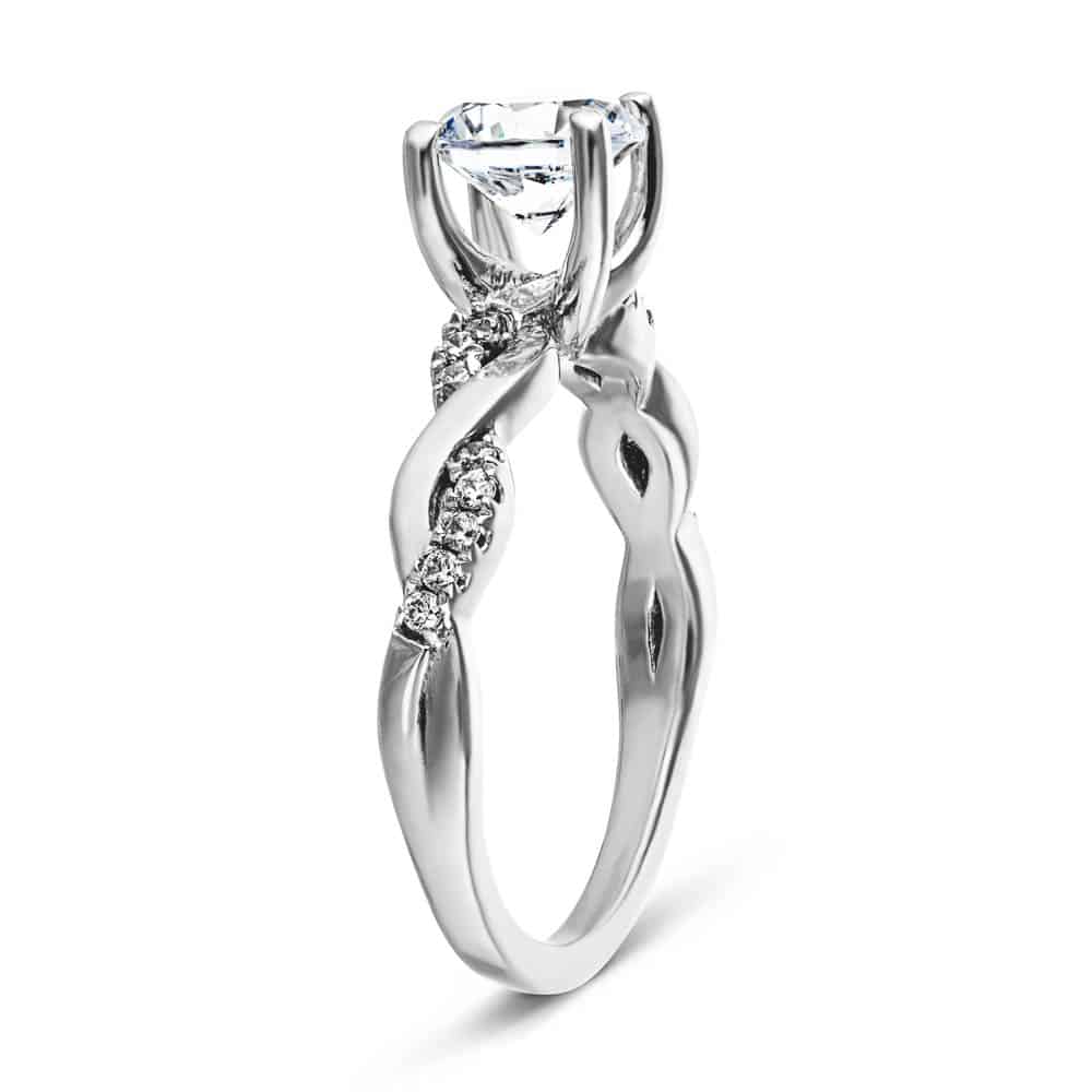 Shown with 1ct Round Cut Lab Grown Diamond in 14k White Gold|Nature inspired engagement ring with twisted diamond accented band featuring 1ct round cut lab grown diamond in 14k white gold shown from side