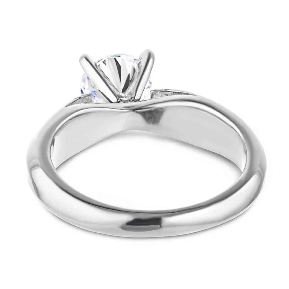 Shown with 1ct Round Cut Lab Grown Diamond in Platinum|Modern solitaire engagement ring with wide band and cathedral style design featuring 1ct round cut lab grown diamond in platinum shown from back