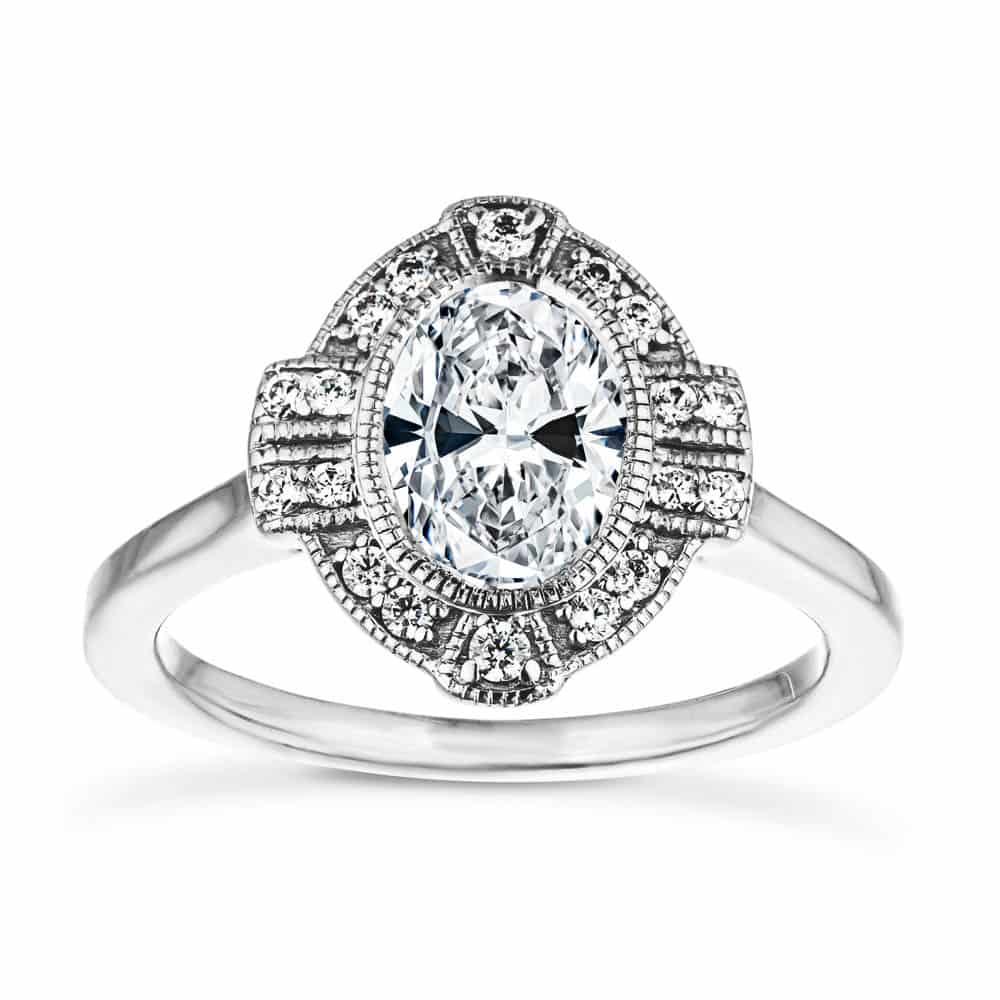 Shown with 1ct Oval Cut Lab Grown Diamond in 14k White Gold|Vintage style engagement ring with milgrain detail diamond accented halo surrounding a 1ct oval cut lab grown diamond in 14k white gold