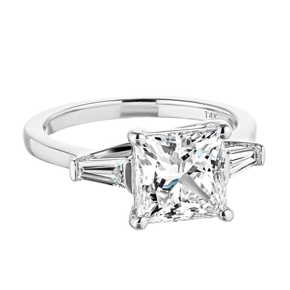 Shown with 2.5ct Princess Cut Lab Grown Diamond set in 14k White Gold|Beautiful three stone engagement ring with trellis set 2.5ct princess cut lab grown diamond amid baguette side stones in 14k white gold shown
