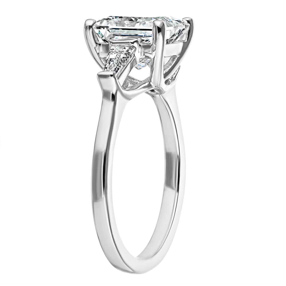 Shown with 2.5ct Princess Cut Lab Grown Diamond set in 14k White Gold|Beautiful three stone engagement ring with trellis set 2.5ct princess cut lab grown diamond amid baguette side stones in 14k white gold shown from side