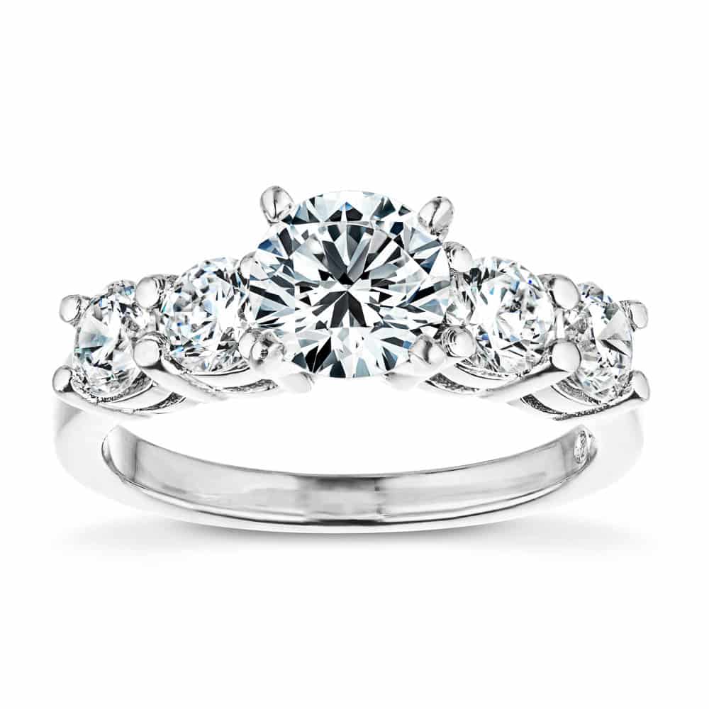 Shown with a 1ct Round Cut Lab Grown Diamond Center Stone amid four 0.25ct Diamond Hybrids in 14k White Gold|Accented engagement ring with a 1ct round cut lab grown diamond amid diamond hybrid simulants totaling 1ctw in 14k white gold