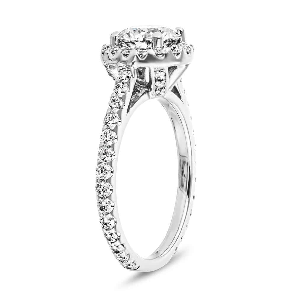 Shown with 1ct Round Cut Lab Grown Diamond in 14k White Gold|Diamond accented halo engagement ring with 1ct round cut lab grown diamond in 14k white gold shown from side