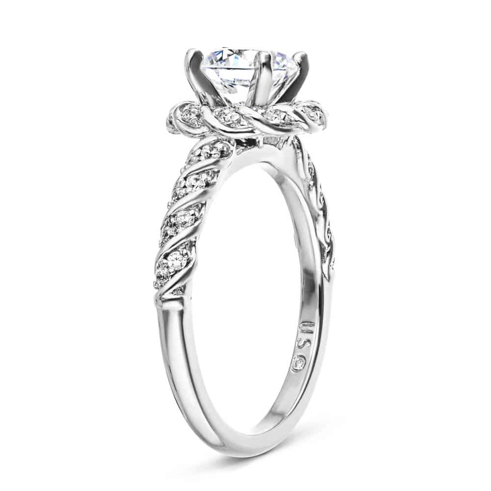Shown with 1ct Round Cut Lab Grown Diamond in 14k White Gold|Nature inspired twisted diamond halo engagement ring with a 1ct round cut lab grown diamond in 14k white gold shown from side