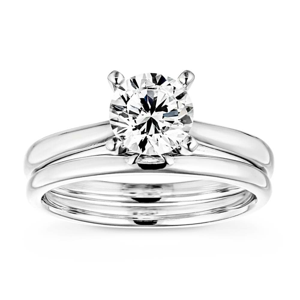 Shown with a 1.0ct Round cut Lab-Grown Diamond in recycled 14K white gold with matching wedding band 