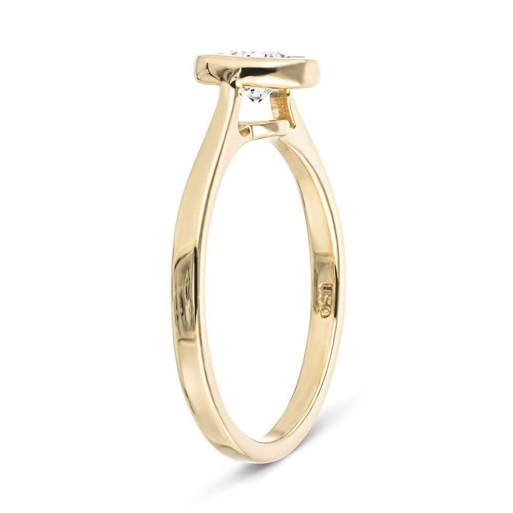 Shown with 1ct Round Cut Lab Grown Diamond in 14k Yellow Gold|Modern engagement ring with 1ct round cut bezel set lab grown diamond in 14k yellow gold shown from side