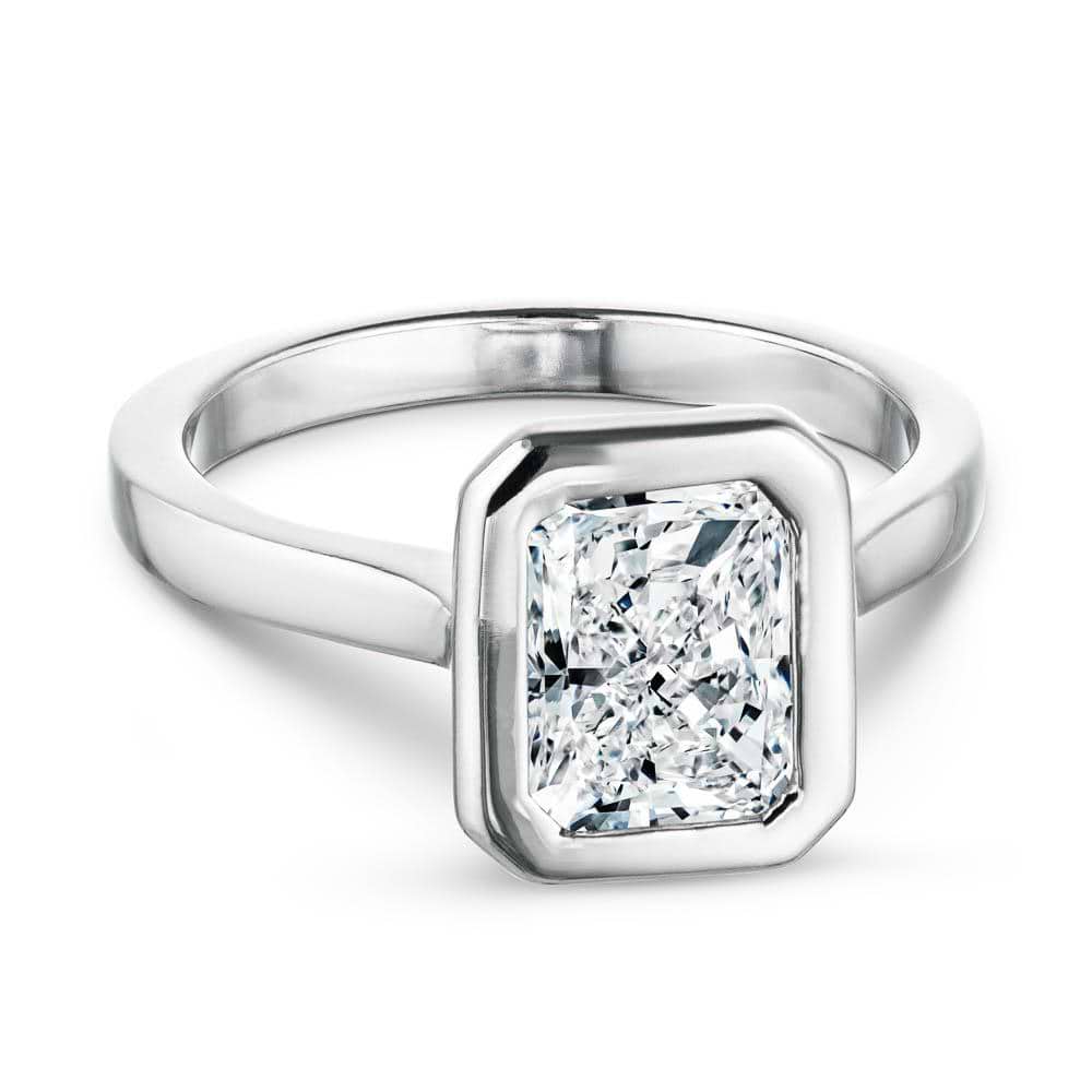Shown with 1ct Radiant Cut Lab Grown Diamond in 14k White Gold|Modern white gold engagement ring with 1ct radiant cut bezel set lab grown diamond