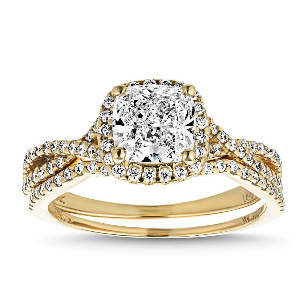 Eternal Monogram Wedding Set shown in recycled 14K yellow gold featuring a cushion cut center stone surrounded by a halo of recycled diamonds continuing down the shank with matching wedding band | eternal monogram wedding set recycled diamonds engagement ring wedding band