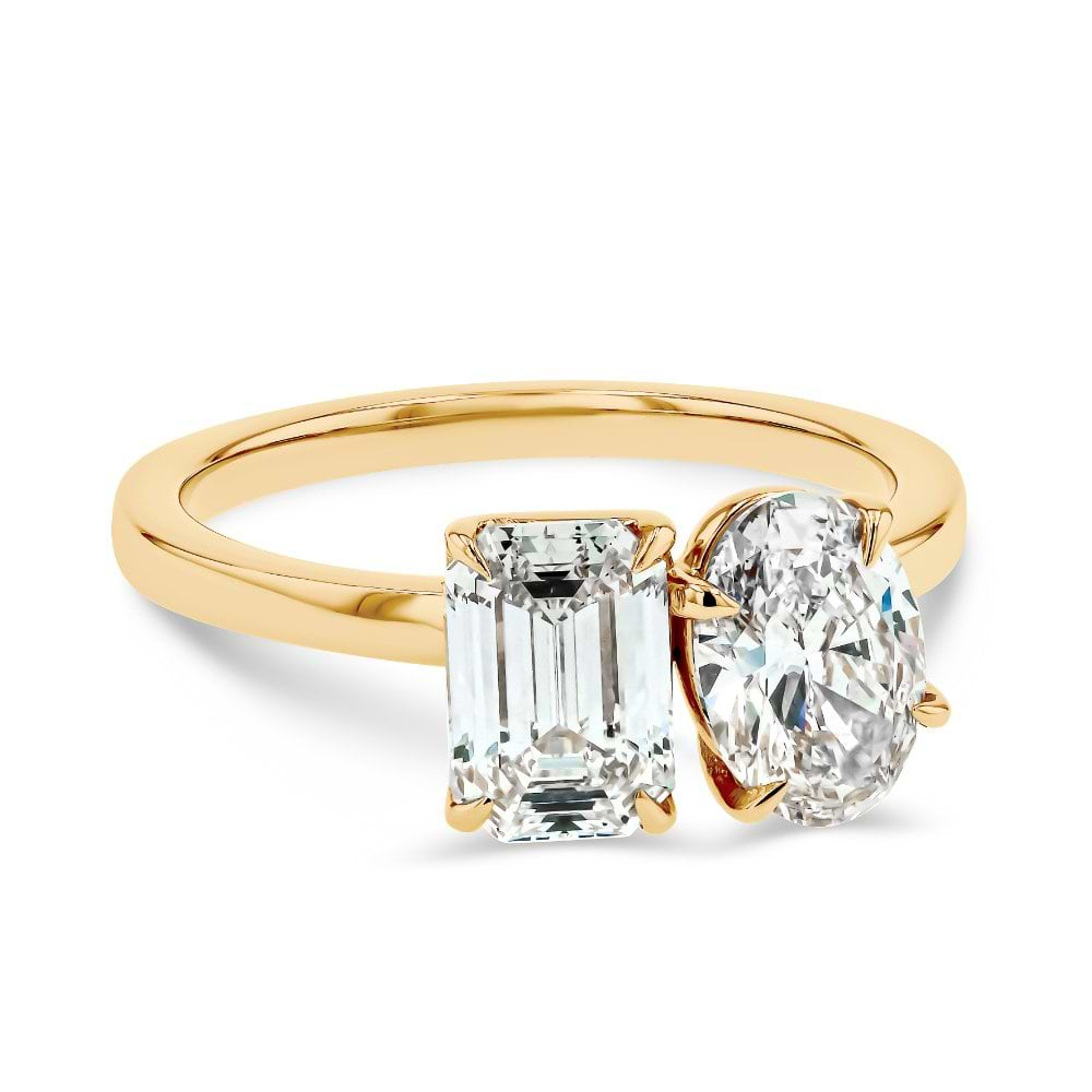 Shown In 14K Yellow Gold With An Emerald Cut and Oval Cut Lab Grown Diamond