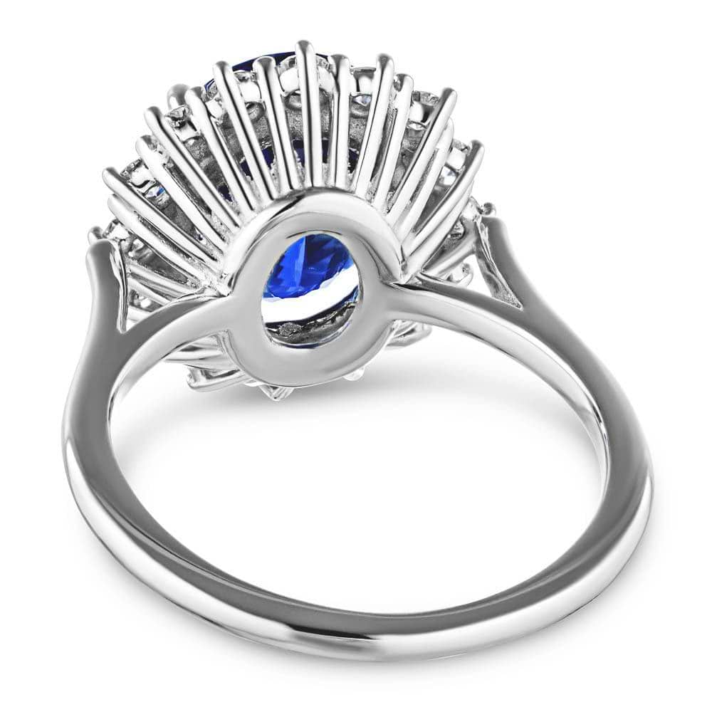 Shown with 3ct Oval Cut Lab Grown Blue Sapphire in 14k White Gold|Vintage style engagement ring with floral design halo around a 3ct lab created blue sapphire in 14k white gold shown from back