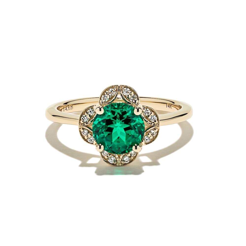 Grace Vintage Engagement Ring shown with a 1.0ct round cut Emerald Lab-Created Gemstone with a petal diamond halo in recycled 14K yellow gold | Grace vintage engagement ring 1.0ct round cut emerald lab-created gemstone petal diamond halo recycled 14K yellow gold