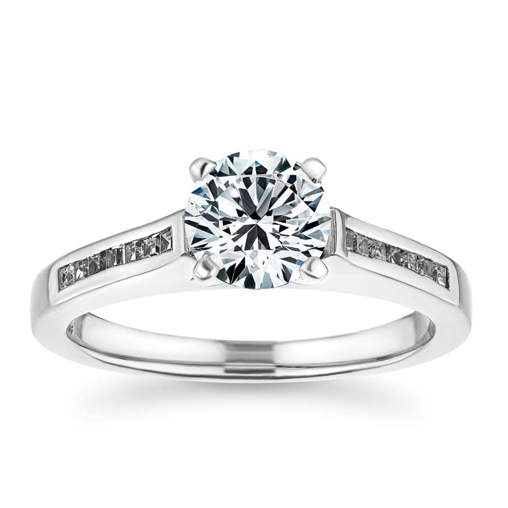 Shown with 1ct Round Cut Lab Grown Diamond in Platinum|Modern channel set diamond accented engagement ring with 1ct round cut lab grown diamond  set in platinum