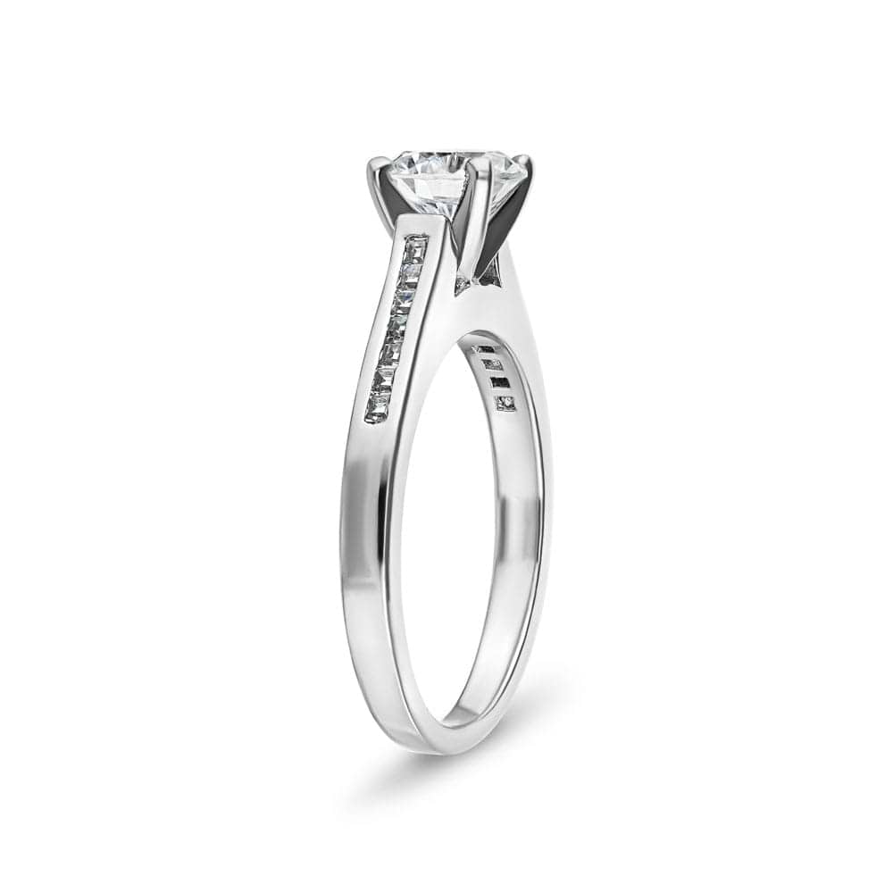 Shown with 1ct Round Cut Lab Grown Diamond in Platinum|Contemporary channel set diamond accented engagement ring with 1ct round cut lab grown diamond  set in platinum