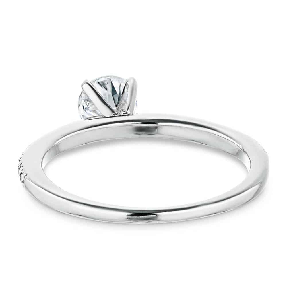 Shown with 0.70ct Round Cut Lab Grown Diamond in 14k White Gold|Diamond accented solitaire engagement ring with 4 prong set round cut lab grown diamond in 14k white gold shown from back