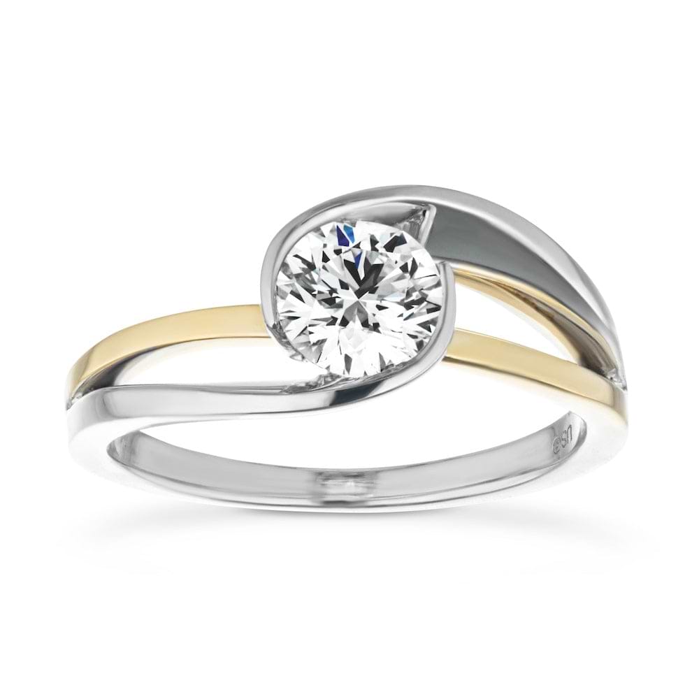 Shown with 1ct Round Cut Lab Grown Diamond in Two Tone 14k White & Yellow Gold|Stunning modern design two tone engagement ring with a bezel set 1ct round cut lab grown diamond in 14k white gold and 14k yellow gold setting
