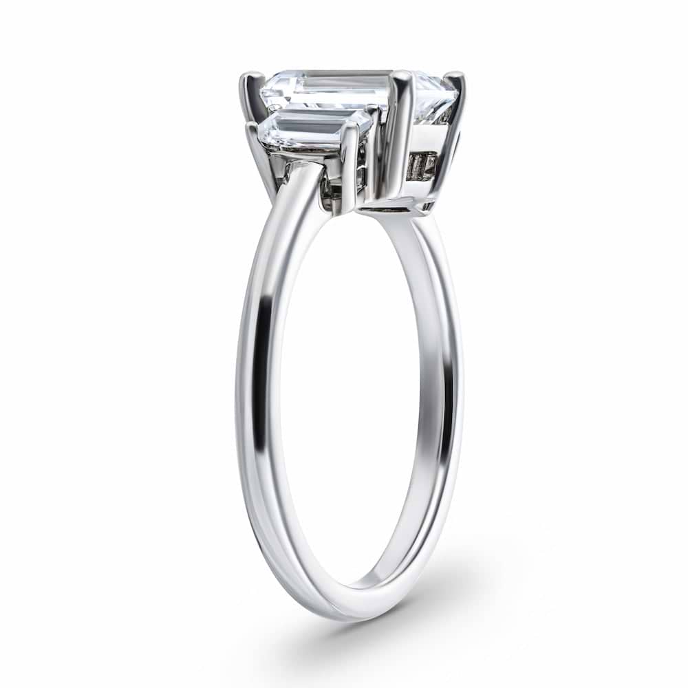 Shown with 1.75ct Emerald Cut Lab Grown Diamond in 14 White Gold|Basket set three stone ring with lab grown diamonds in 14k white gold shown from side