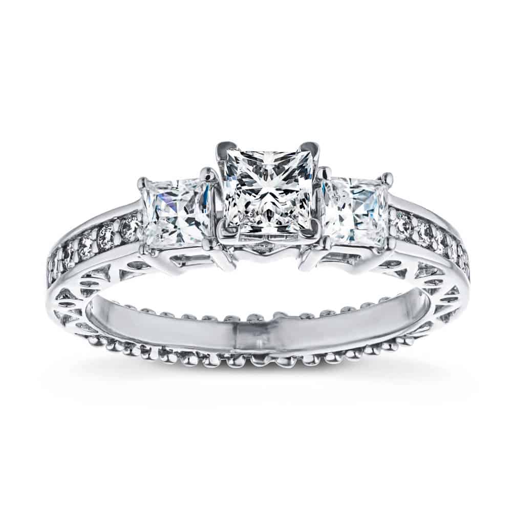 Shown with Three Princess Cut Lab Grown Diamonds Set in 14k White Gold|Vintage style three stone engagement ring with princess cut lab grown diamonds and filigree detailing in 14k white gold