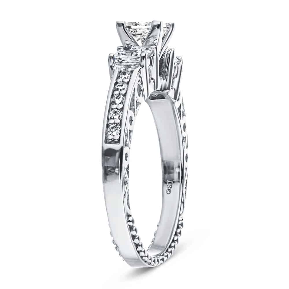 Shown with Three Princess Cut Lab Grown Diamonds Set in 14k White Gold|Vintage style three stone engagement ring with diamond accented band and princess cut lab grown diamonds in 14k white gold shown from side