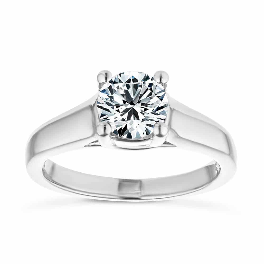 Shown with 1ct Round Cut Lab Grown Diamond in 14k White Gold|Ethical solitaire engagement ring with trellis style set 1ct round cut lab grown diamond in a wide 14k white gold band
