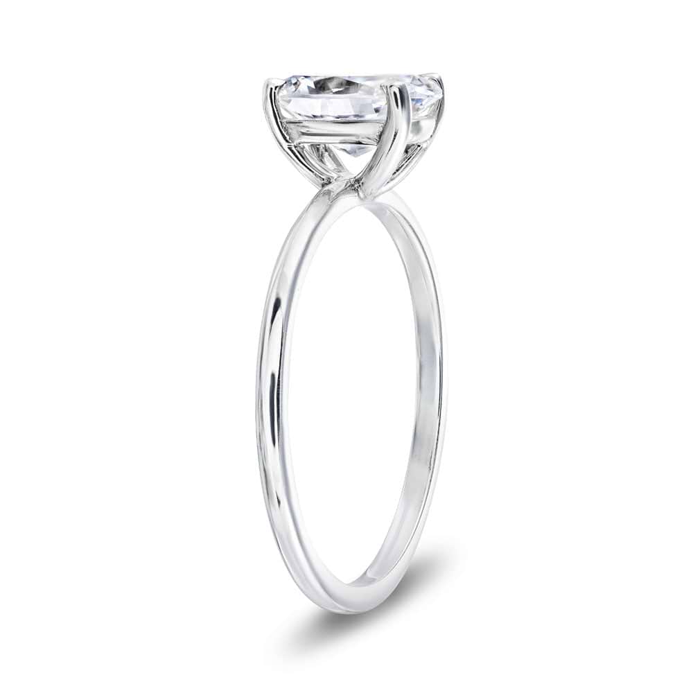 Shown with 1ct Oval Cut Lab Grown Diamond in 14k White Gold|Classic solitaire engagement ring with 1ct oval cut lab grown diamond in 14k white gold band shown from side
