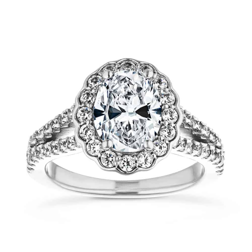 Shown with 1ct Oval Cut Lab Grown Diamond in 14k White Gold|Beautiful nature inspired floral halo engagement ring with diamond accented split shank holding a 1ct oval cut lab grown diamond in 14k white gold