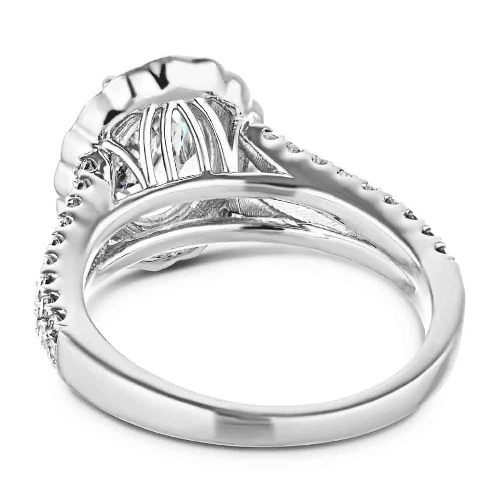 Shown with 1ct Oval Cut Lab Grown Diamond in 14k White Gold|Flower halo engagement ring with diamond accented split shank holding a 1ct oval cut lab grown diamond in 14k white gold shown from back